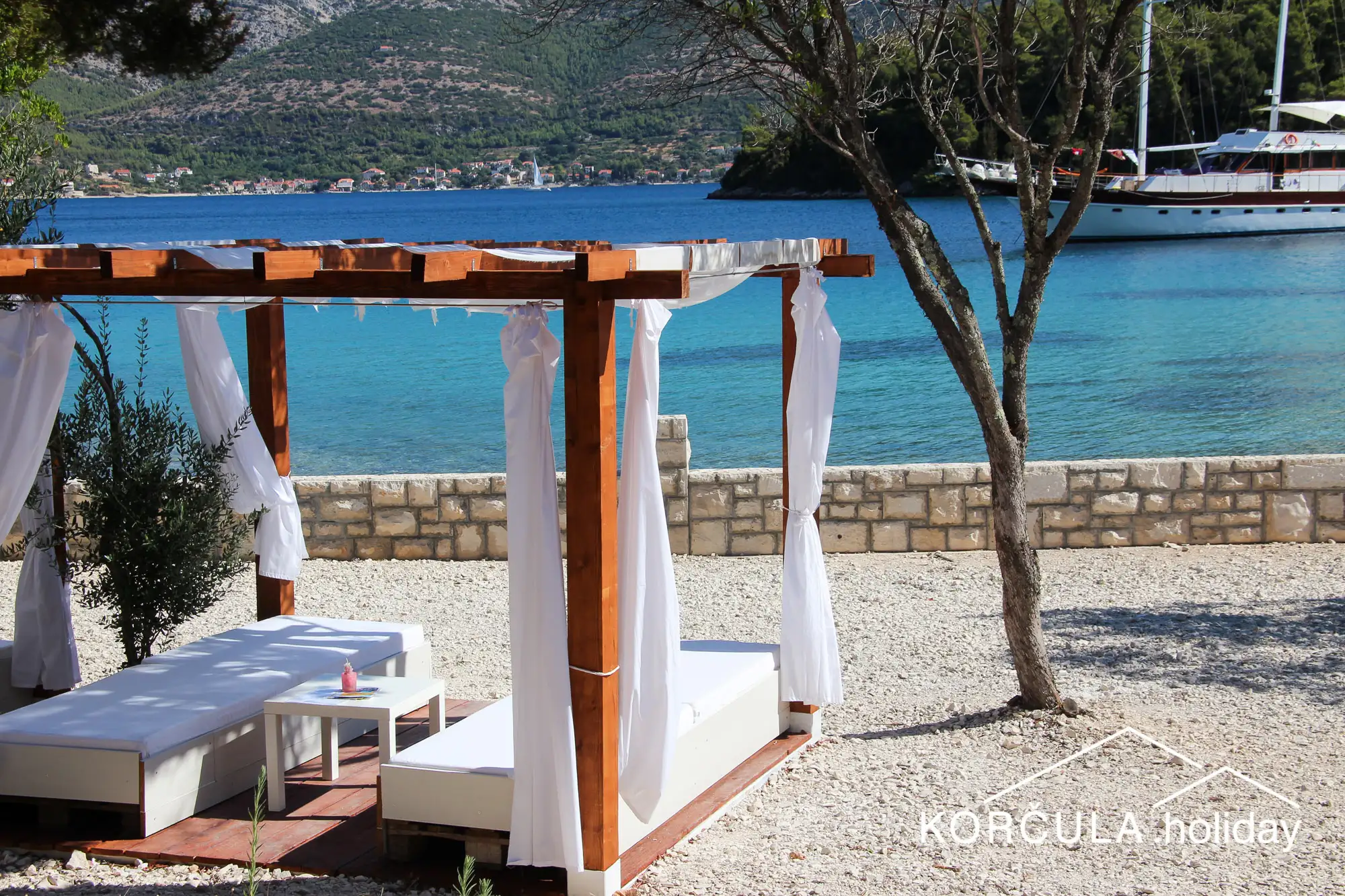 romantic sunbeds on the beach
